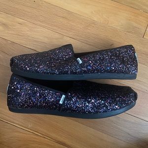 Black glitter Toms slip on